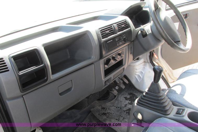 image for item E5072 1999 Mitsubishi minicab truck with dump bed