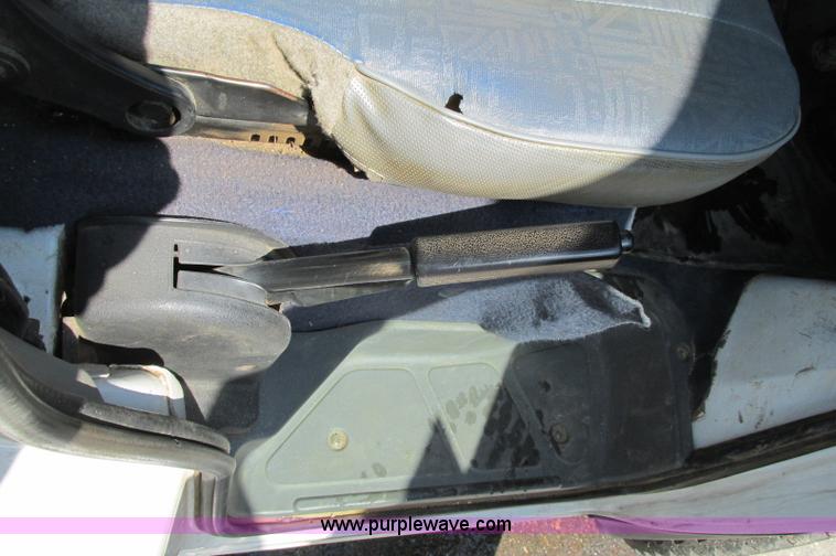 image for item E5072 1999 Mitsubishi minicab truck with dump bed