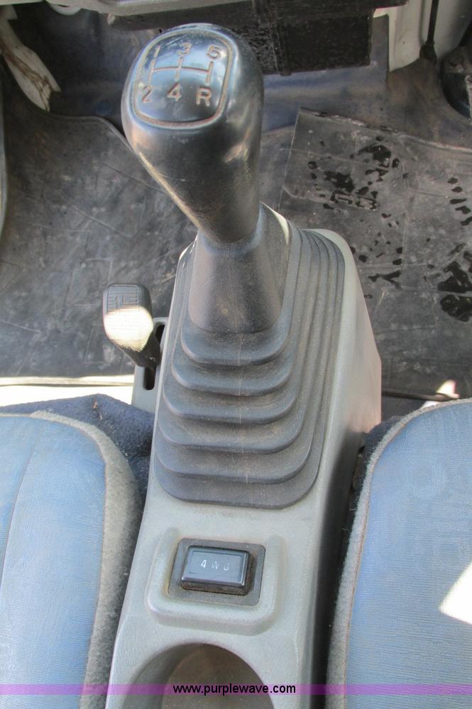 image for item E5072 1999 Mitsubishi minicab truck with dump bed