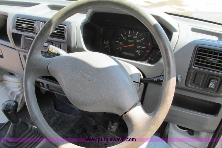 image for item E5072 1999 Mitsubishi minicab truck with dump bed