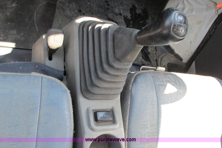 image for item E5072 1999 Mitsubishi minicab truck with dump bed