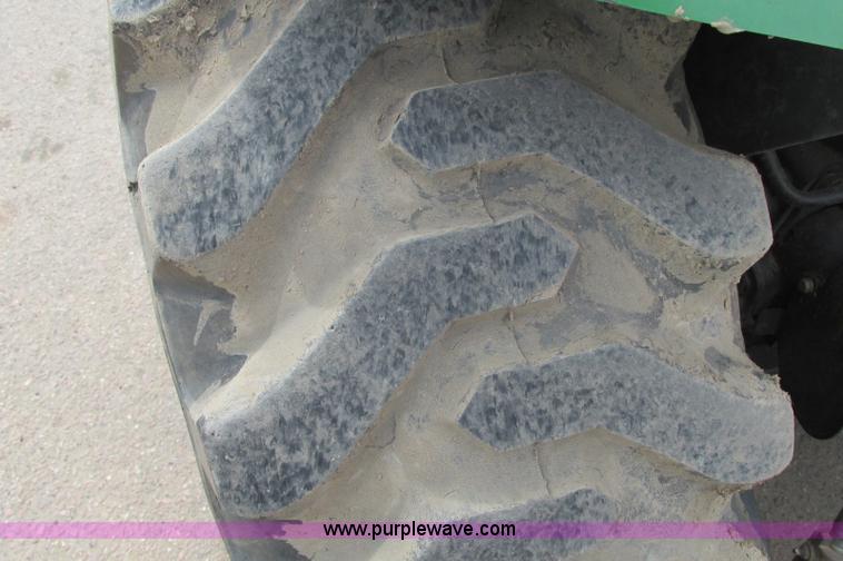 image for item E5131 2002 John Deere 4410 MFWD tractor