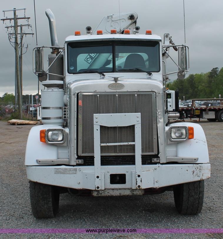 image for item H3580 1998 Peterbilt 320 flatbed truck with knuckle boom crane