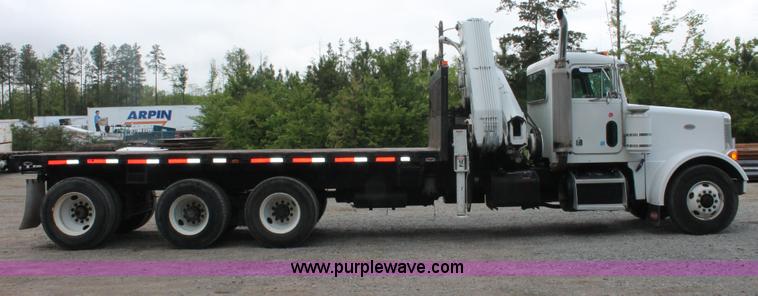 image for item H3580 1998 Peterbilt 320 flatbed truck with knuckle boom crane