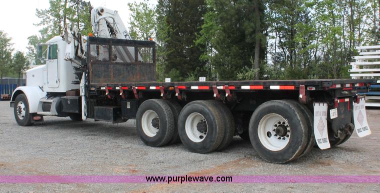 image for item H3580 1998 Peterbilt 320 flatbed truck with knuckle boom crane
