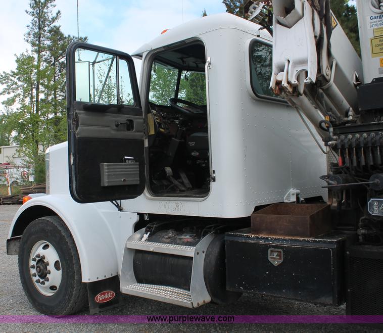 image for item H3580 1998 Peterbilt 320 flatbed truck with knuckle boom crane