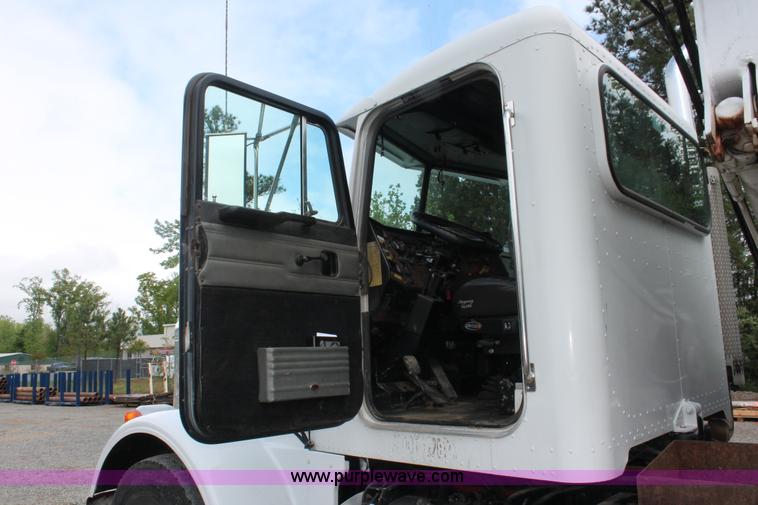 image for item H3580 1998 Peterbilt 320 flatbed truck with knuckle boom crane