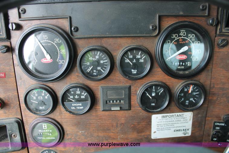 image for item H3580 1998 Peterbilt 320 flatbed truck with knuckle boom crane