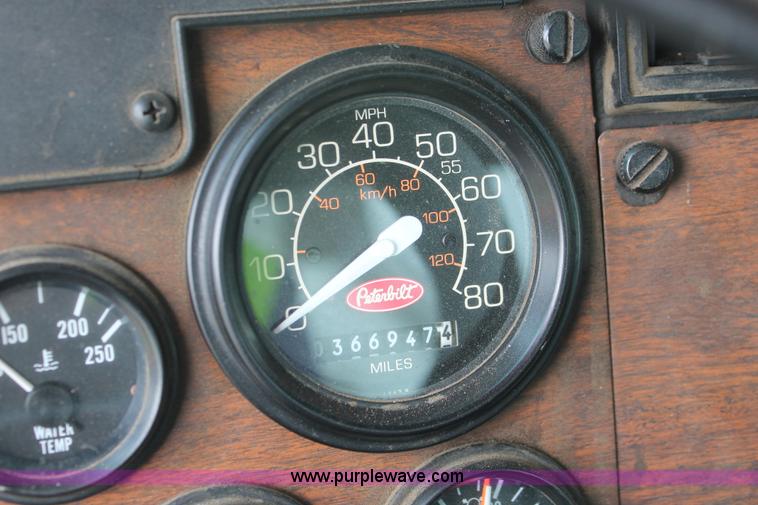 image for item H3580 1998 Peterbilt 320 flatbed truck with knuckle boom crane