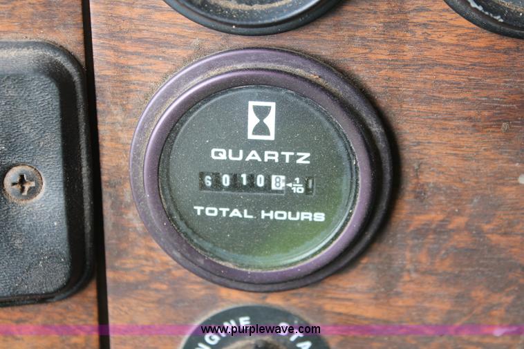 image for item H3580 1998 Peterbilt 320 flatbed truck with knuckle boom crane