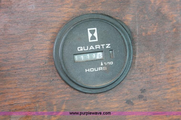 image for item H3580 1998 Peterbilt 320 flatbed truck with knuckle boom crane