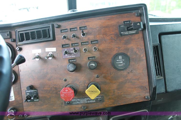 image for item H3580 1998 Peterbilt 320 flatbed truck with knuckle boom crane