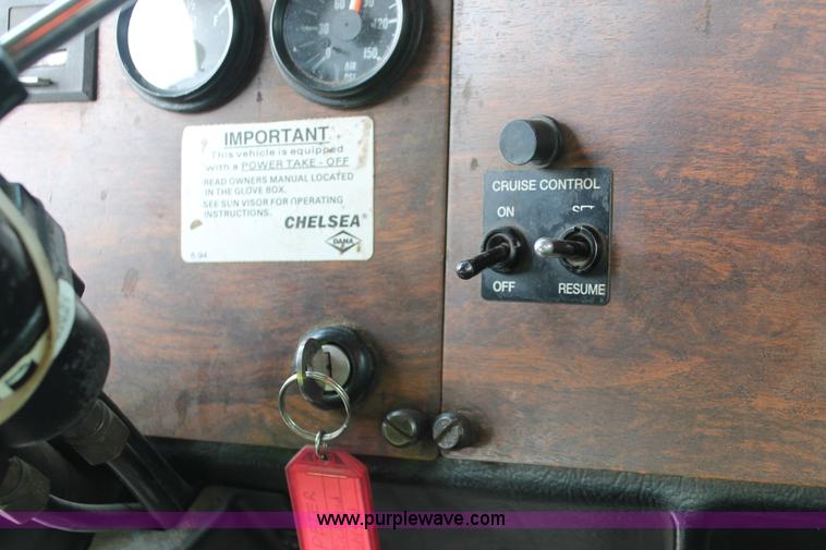 image for item H3580 1998 Peterbilt 320 flatbed truck with knuckle boom crane