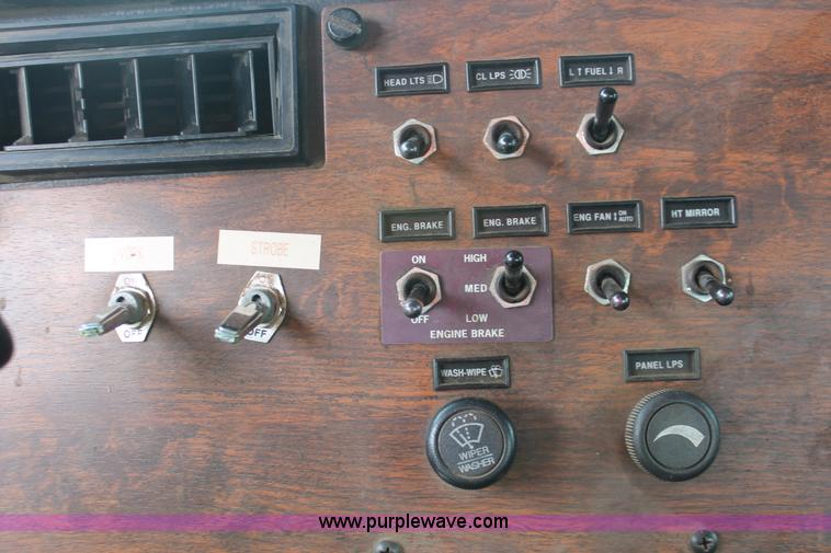 image for item H3580 1998 Peterbilt 320 flatbed truck with knuckle boom crane