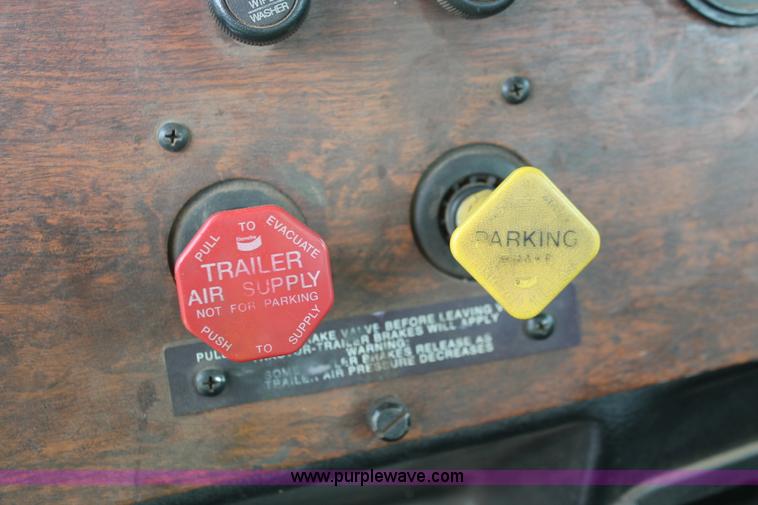 image for item H3580 1998 Peterbilt 320 flatbed truck with knuckle boom crane