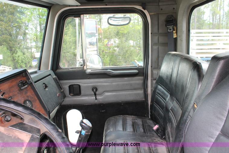 image for item H3580 1998 Peterbilt 320 flatbed truck with knuckle boom crane