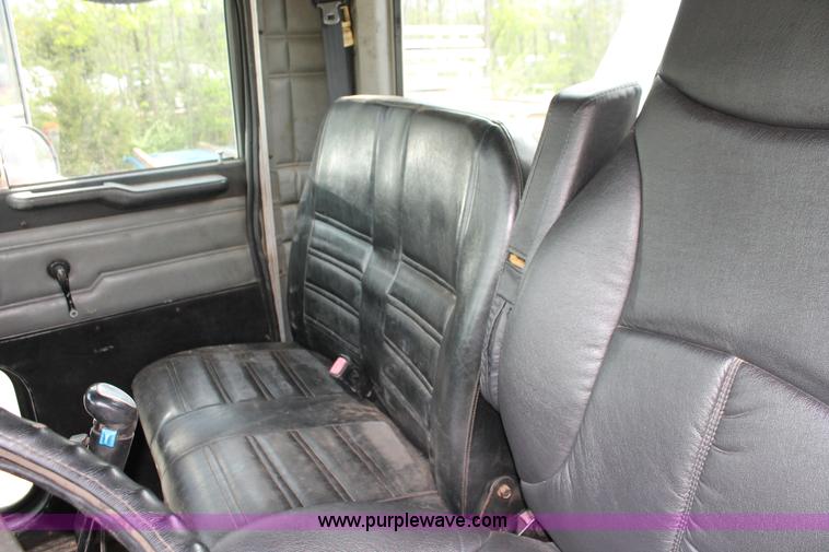 image for item H3580 1998 Peterbilt 320 flatbed truck with knuckle boom crane