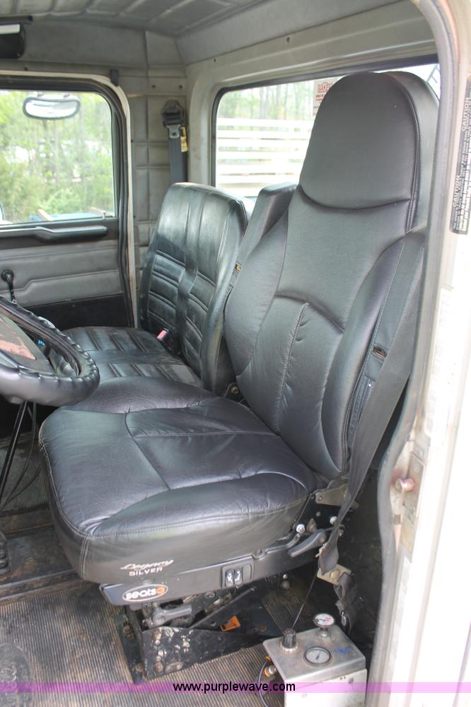 image for item H3580 1998 Peterbilt 320 flatbed truck with knuckle boom crane