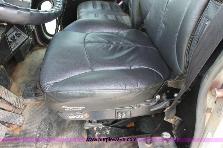 image for item H3580 1998 Peterbilt 320 flatbed truck with knuckle boom crane