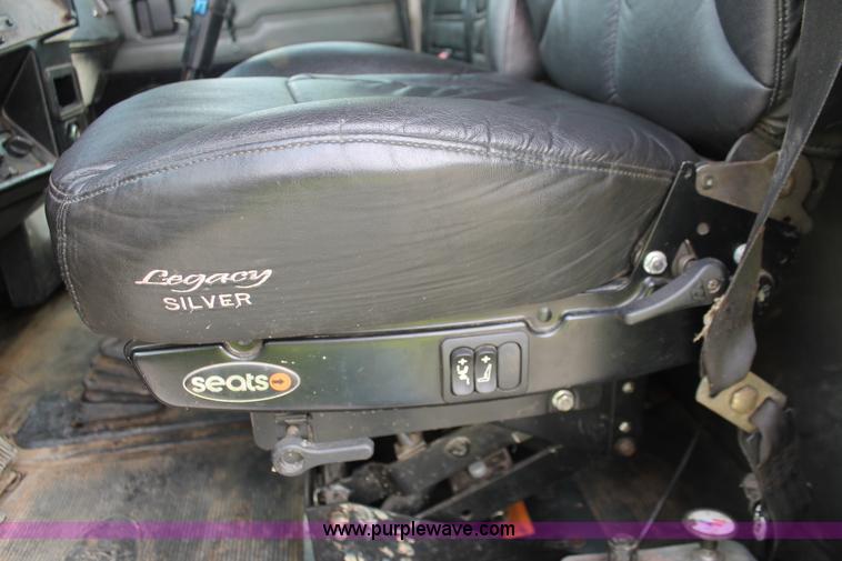 image for item H3580 1998 Peterbilt 320 flatbed truck with knuckle boom crane