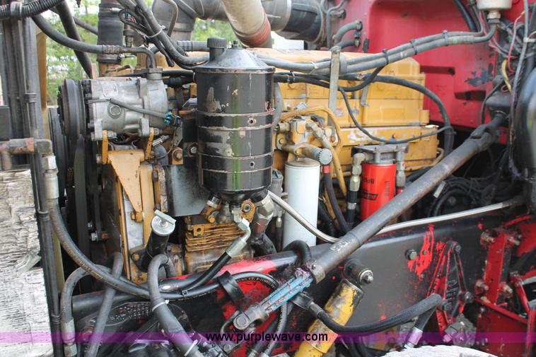 image for item H3580 1998 Peterbilt 320 flatbed truck with knuckle boom crane