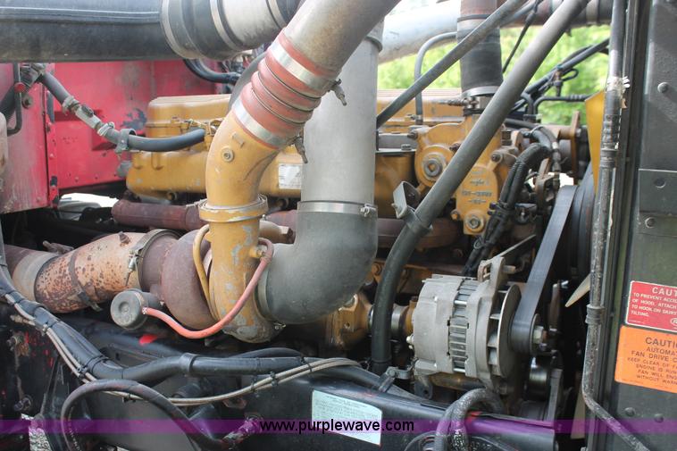 image for item H3580 1998 Peterbilt 320 flatbed truck with knuckle boom crane