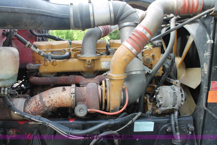 image for item H3580 1998 Peterbilt 320 flatbed truck with knuckle boom crane