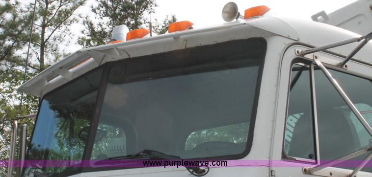 image for item H3580 1998 Peterbilt 320 flatbed truck with knuckle boom crane