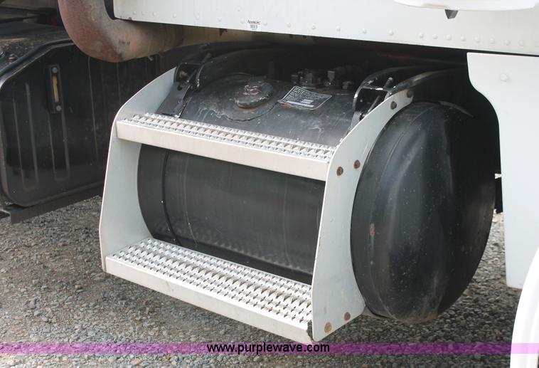 image for item H3580 1998 Peterbilt 320 flatbed truck with knuckle boom crane