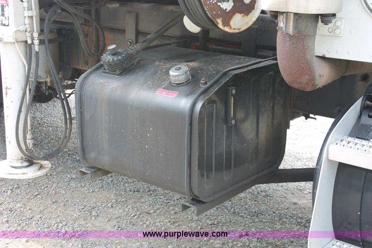 image for item H3580 1998 Peterbilt 320 flatbed truck with knuckle boom crane