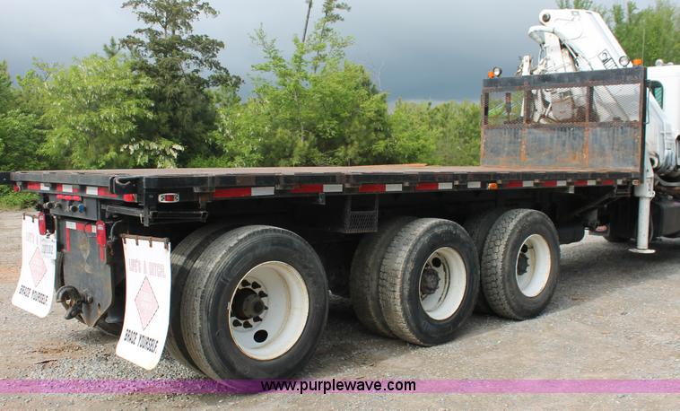 image for item H3580 1998 Peterbilt 320 flatbed truck with knuckle boom crane