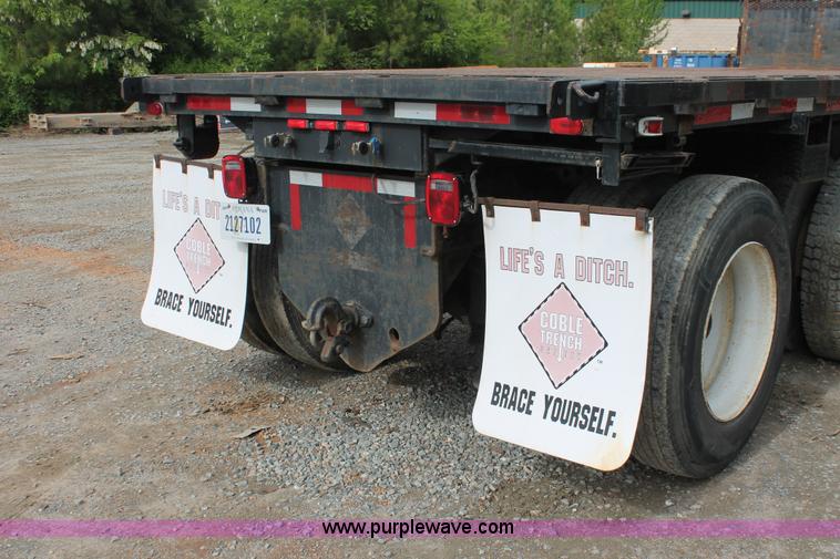 image for item H3580 1998 Peterbilt 320 flatbed truck with knuckle boom crane