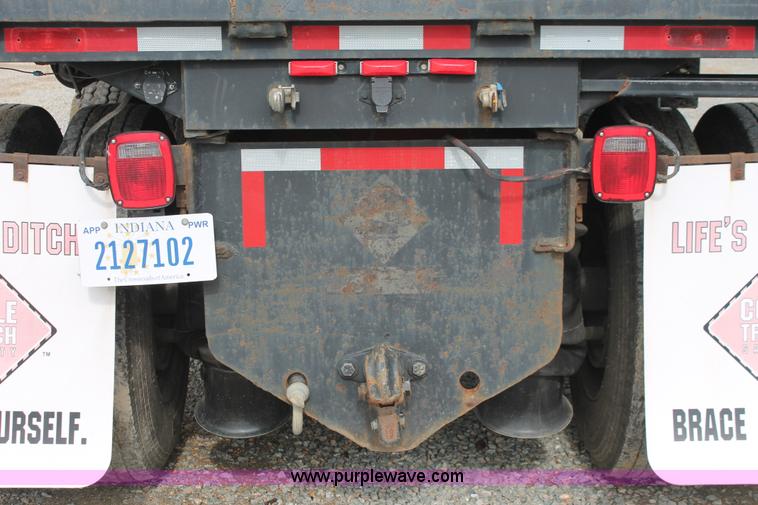 image for item H3580 1998 Peterbilt 320 flatbed truck with knuckle boom crane