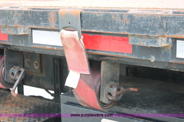 image for item H3580 1998 Peterbilt 320 flatbed truck with knuckle boom crane