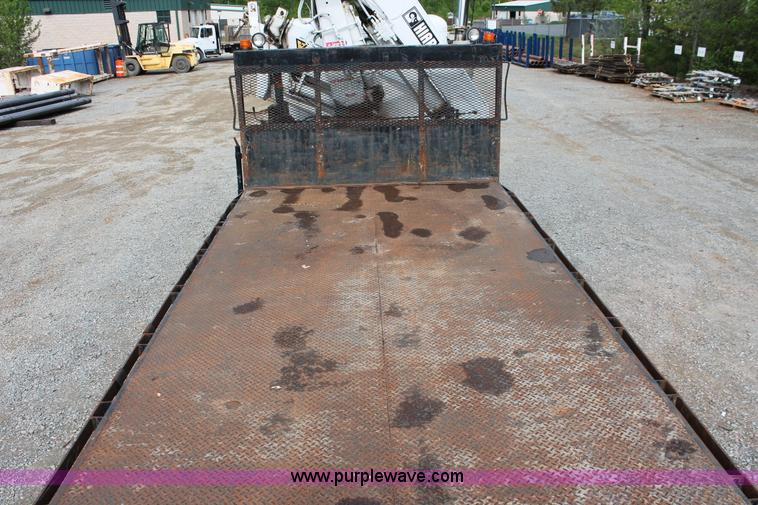 image for item H3580 1998 Peterbilt 320 flatbed truck with knuckle boom crane