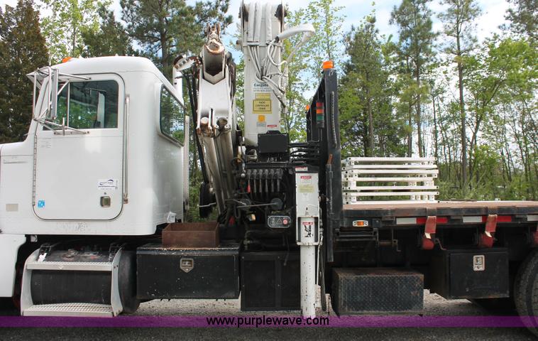image for item H3580 1998 Peterbilt 320 flatbed truck with knuckle boom crane