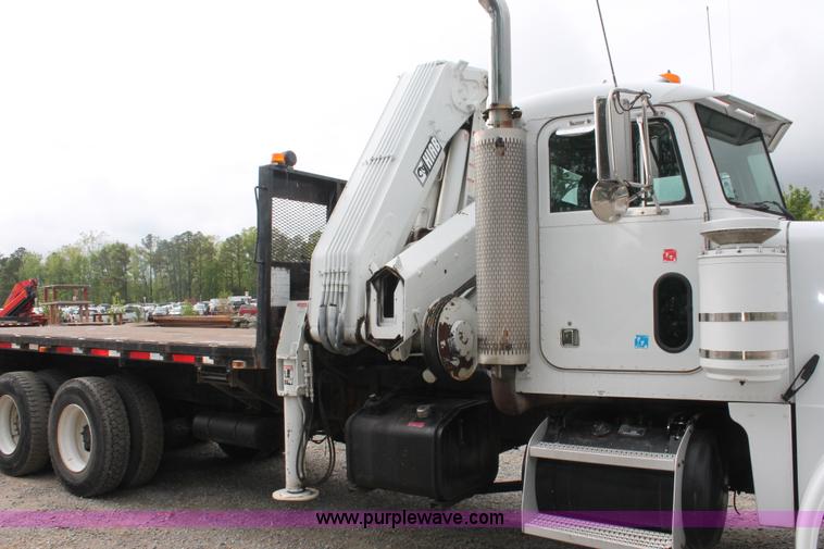 image for item H3580 1998 Peterbilt 320 flatbed truck with knuckle boom crane