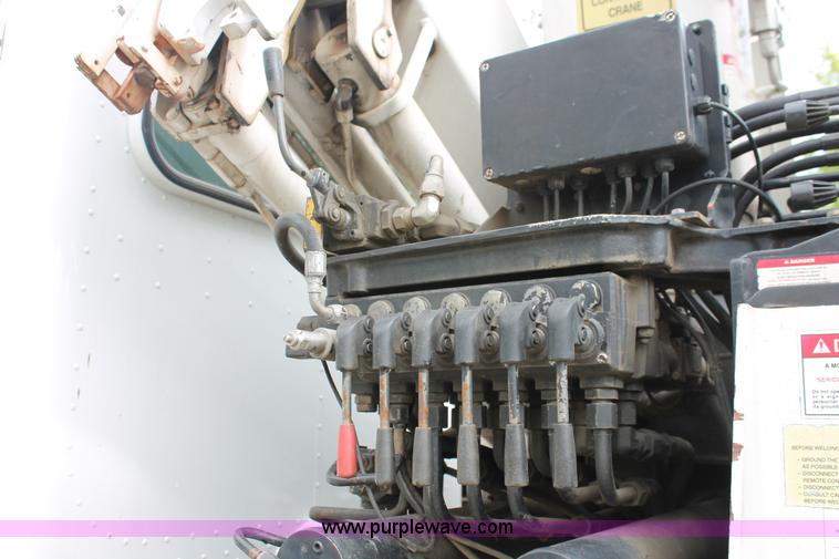 image for item H3580 1998 Peterbilt 320 flatbed truck with knuckle boom crane