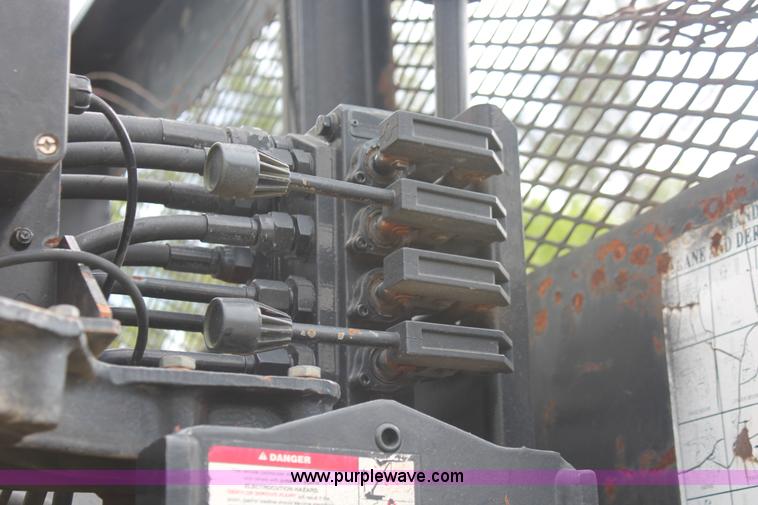 image for item H3580 1998 Peterbilt 320 flatbed truck with knuckle boom crane