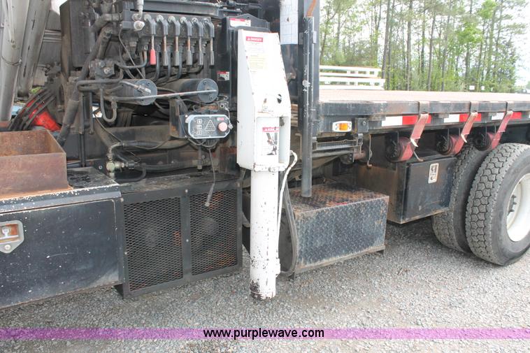 image for item H3580 1998 Peterbilt 320 flatbed truck with knuckle boom crane