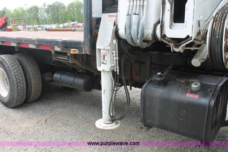 image for item H3580 1998 Peterbilt 320 flatbed truck with knuckle boom crane