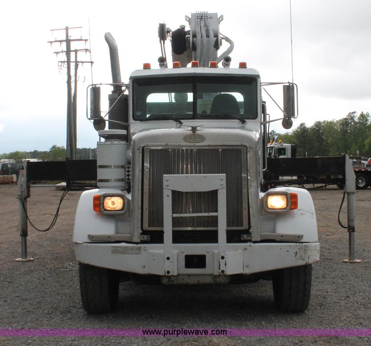 image for item H3580 1998 Peterbilt 320 flatbed truck with knuckle boom crane