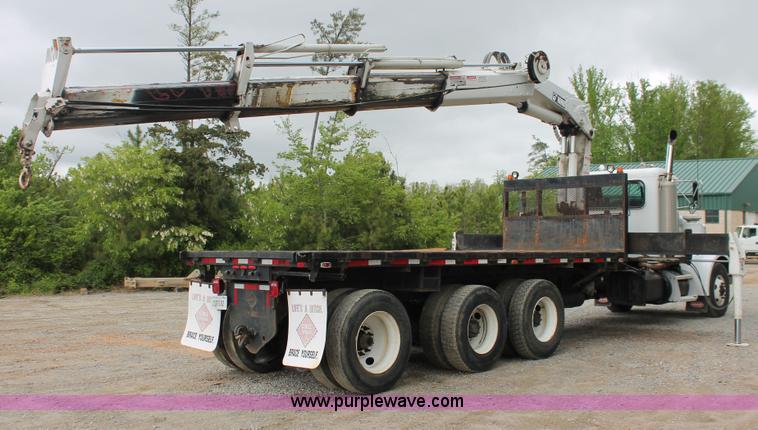 image for item H3580 1998 Peterbilt 320 flatbed truck with knuckle boom crane