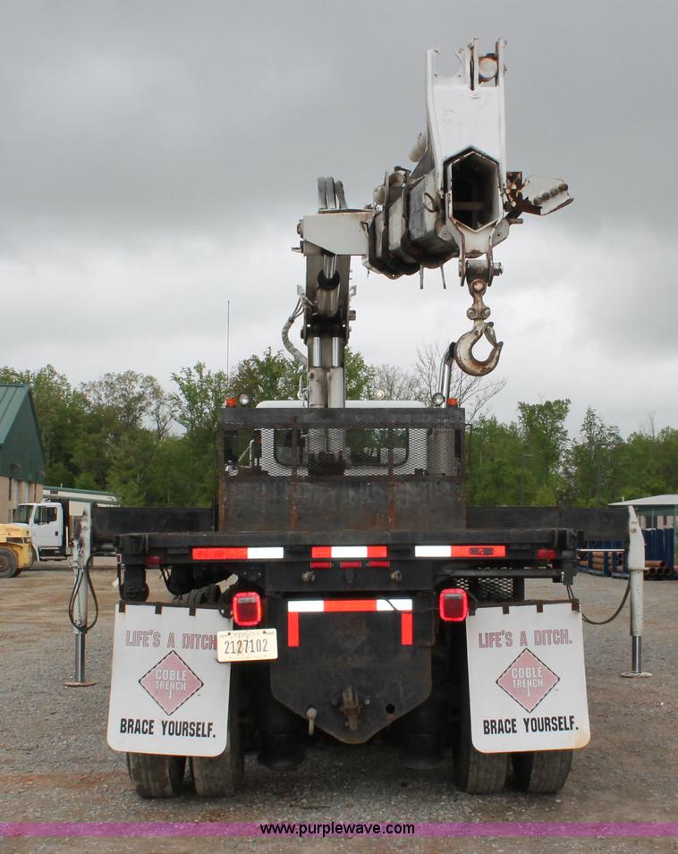 image for item H3580 1998 Peterbilt 320 flatbed truck with knuckle boom crane