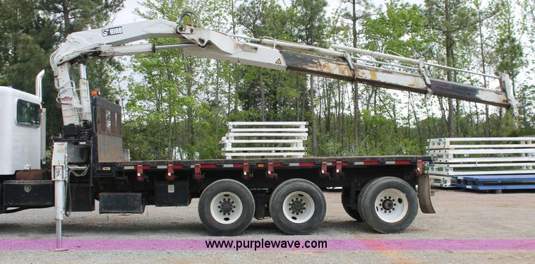 image for item H3580 1998 Peterbilt 320 flatbed truck with knuckle boom crane