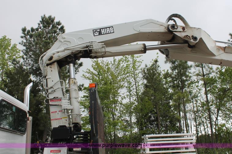 image for item H3580 1998 Peterbilt 320 flatbed truck with knuckle boom crane