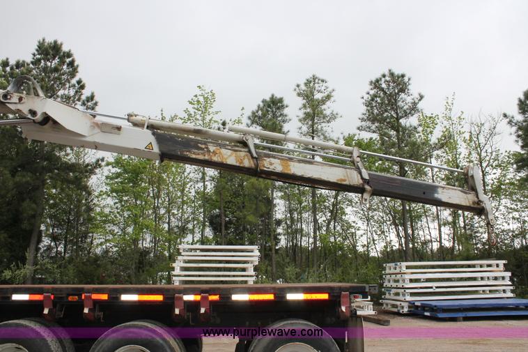 image for item H3580 1998 Peterbilt 320 flatbed truck with knuckle boom crane