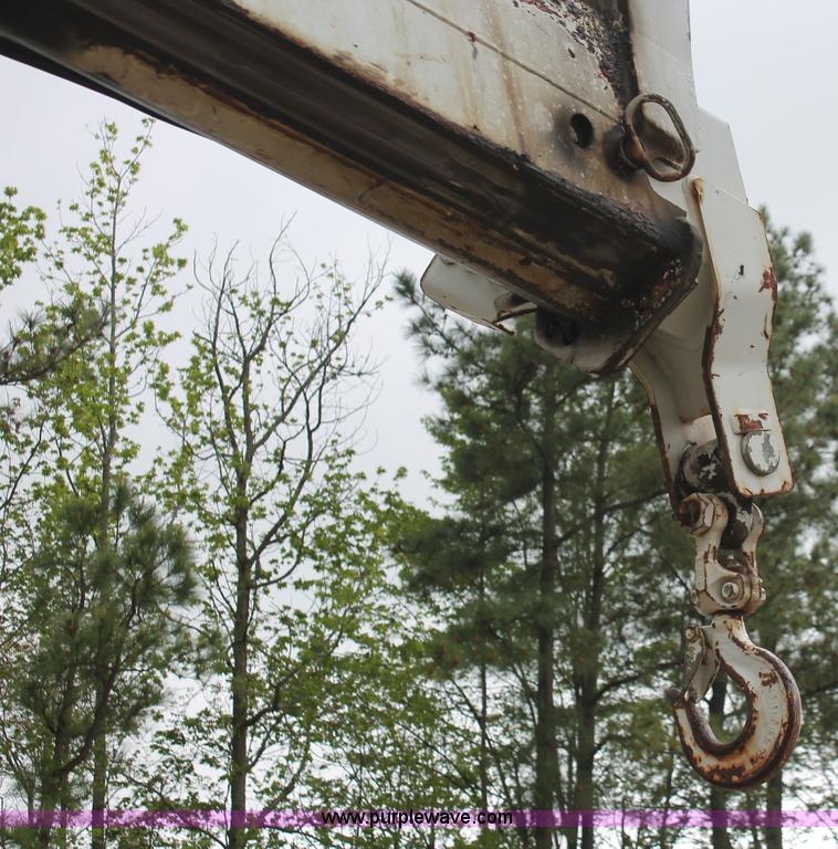 image for item H3580 1998 Peterbilt 320 flatbed truck with knuckle boom crane