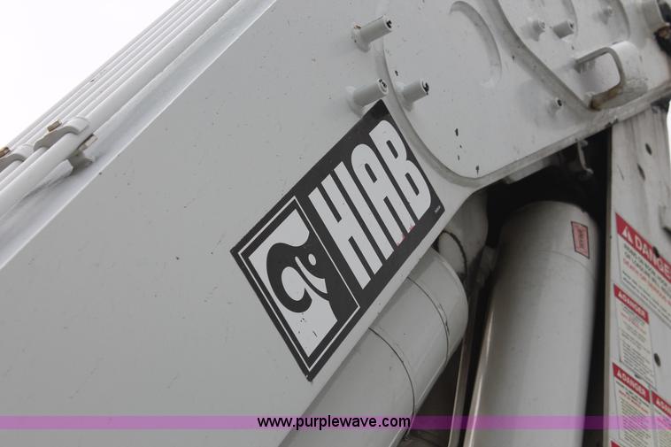 image for item H3580 1998 Peterbilt 320 flatbed truck with knuckle boom crane