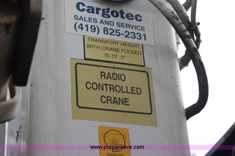 image for item H3580 1998 Peterbilt 320 flatbed truck with knuckle boom crane